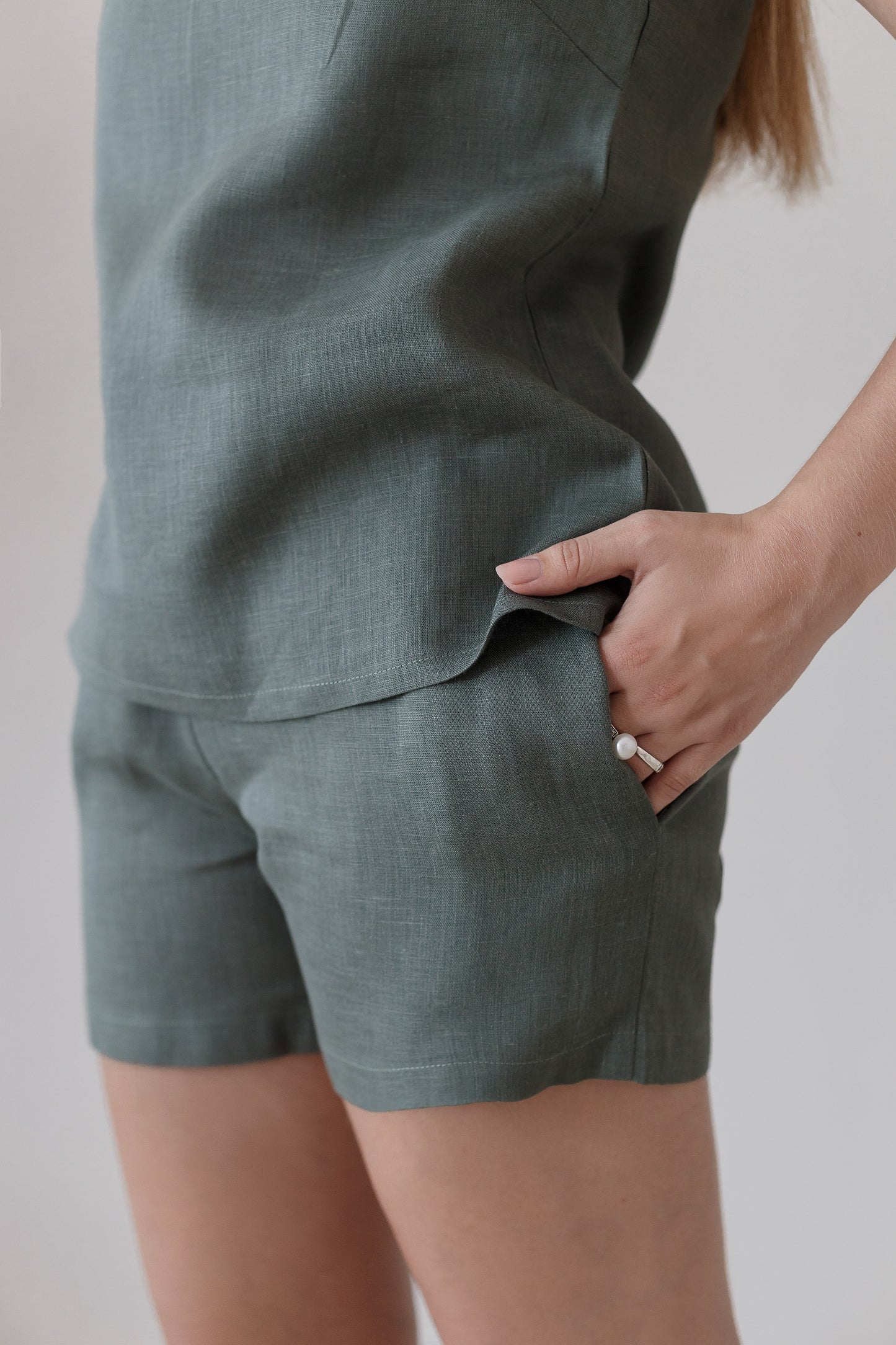 Matching green linen shorts with elastic waistband